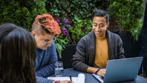 Schedule Meaningful Relationships: The Key to Deeper Connections 1 a group of people sitting at a table looking at a laptop