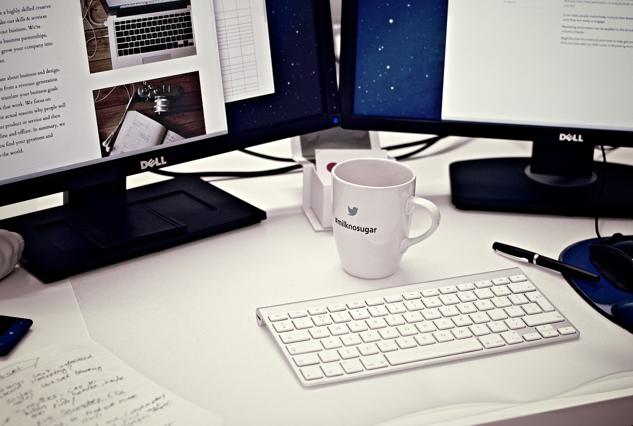 white mug and computer