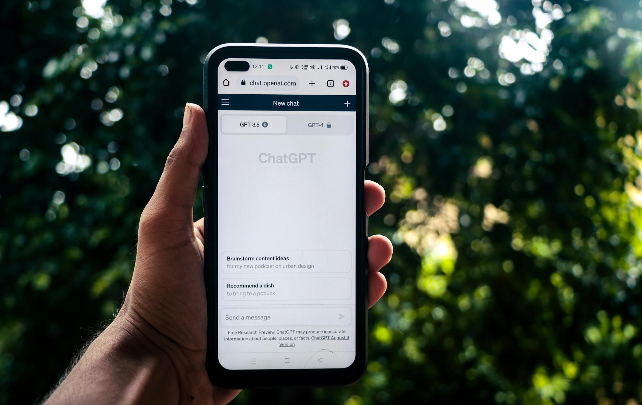 Crafting the Perfect Blog Structure: A Guide for Effective Blogging 1 a person uses chatgpt on a smartphone